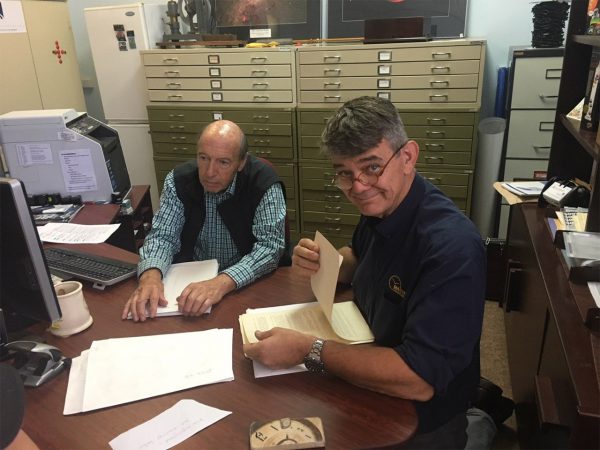 Andrew Markerink and Michael Myers inspect original drawings of the Shortt Synchronomes. Image Credit: Paul Fisher