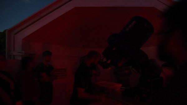 Attendees looking at the Orion Nebula. Image Credit: Matt Woods