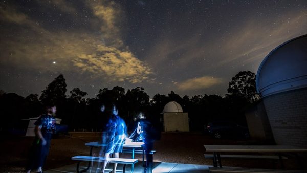 Attendees setting up their cameras on a nightscapes workshop. Image Credit: Matt Woods