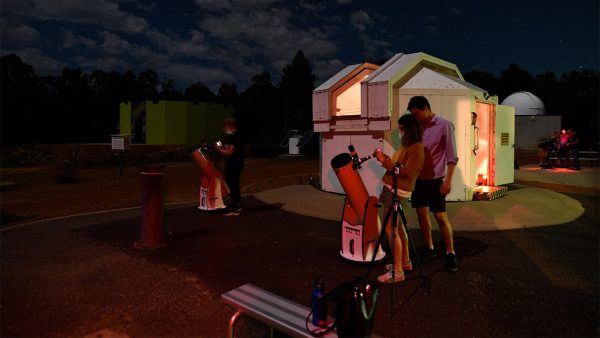 Attendee using the Dobsonian Telescopes to photograph the Moon. Image Credit: Matt Woods