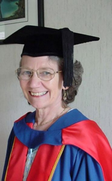 Chris in her doctoral gown. Image Credit: Coulstock family