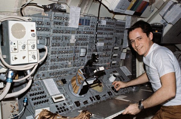 Scientist-astronaut Edward G. Gibson, Skylab 4 science pilot, stands at the Apollo Telescope Mount (ATM) console. Image Credit: NASA