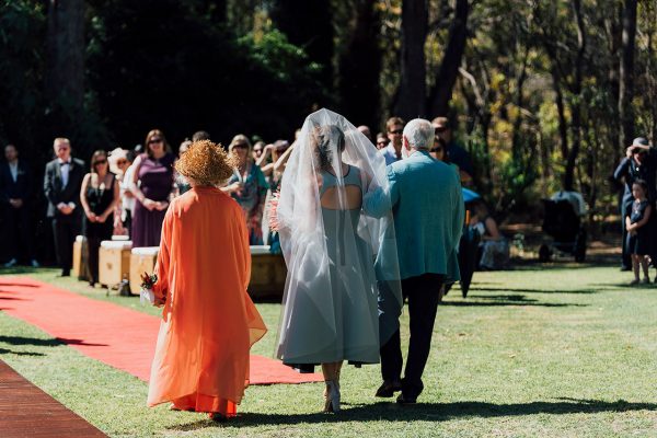 Francis and her parents walking down the aisle. Image Copyright: Michelle Lucking (Lucking Photography)