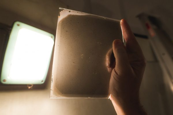 One of our glass plate help up to a light. Image Credit: Zal Kanga-Parabia