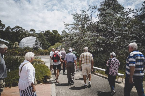 Day tour group walking to the Meredian Telescope. Image Credit: Matt Woods