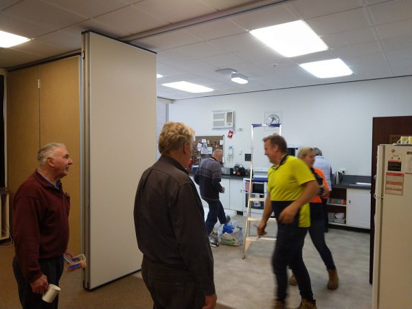 Installing the new dividing walls between the kitchen and presentation room. Image Credit: Matt Woods