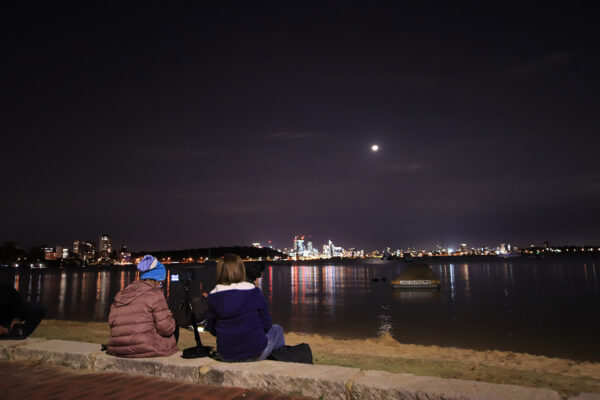 Ladies watching a total lunar eclipse. Image Credit: Perth Observatory