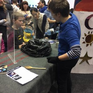 Volunteer Kim Steele making a comet. Image Credit: Michelle Ashley Emile