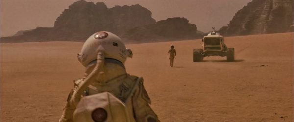 Astronaut walking to the Mars roaming vehicle. Image Credit: Magnolia Pictures