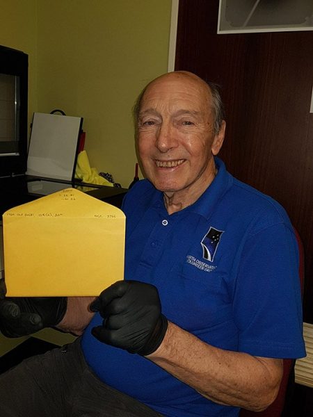 Volunteer Michael with the 20,000 scanned glass plate's sleeve. Image Credit: Sue Knight