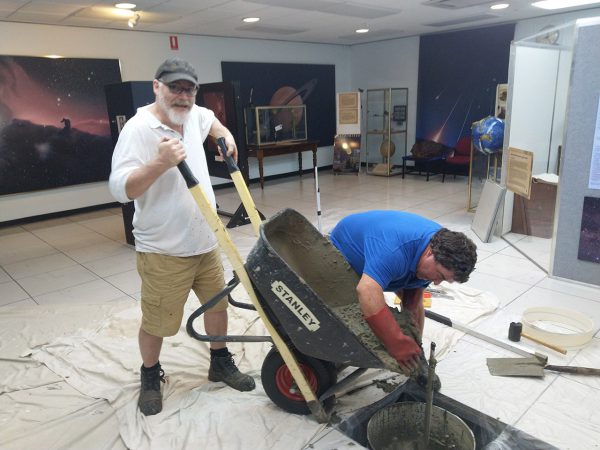 Paul and Rob pouring cement in the Museum. Image Credit: Matt Woods