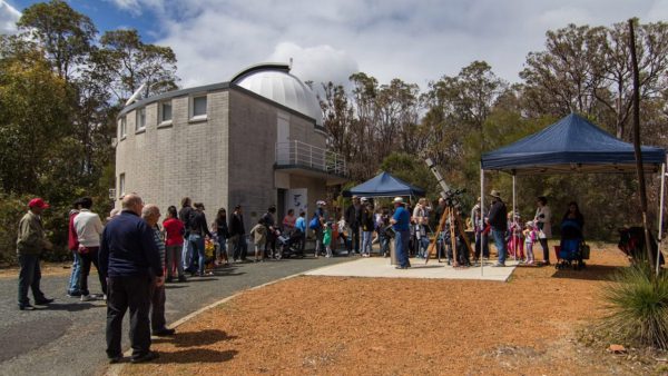People safely looking through solar telescopes. Image Credit: Geoff Scott