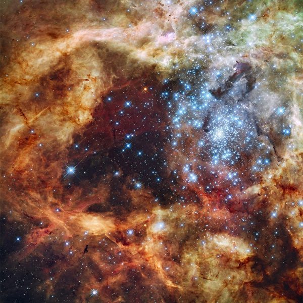 Image of the R136 super star cluster, near the center of the Tarantula Nebula. Image Credit: NASA, ESA, F. Paresce (INAF-IASF, Bologna, Italy), R. O'Connell (University of Virginia, Charlottesville), and the Wide Field Camera 3 Science Oversight Committee