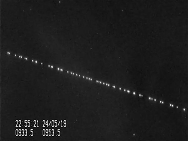 A train of SpaceX Starlink satellites are visible in the night sky in this still from a video captured by satellite tracker Marco Langbroek in Leiden, the Netherlands on May 24, 2019, just one day after SpaceX launched 60 of the Starlink internet communications satellites into orbit. Image credit: Marco Langbroek via SatTrackBlog