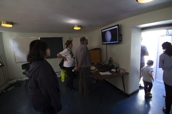 People viewing the sun safely. Image Credit: Geoff Scott