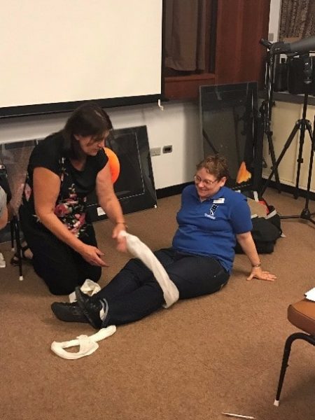 Cathy (trainer) showing us how to bandage up Suzanne after the zombie rampage. Image credit: Roger Groom