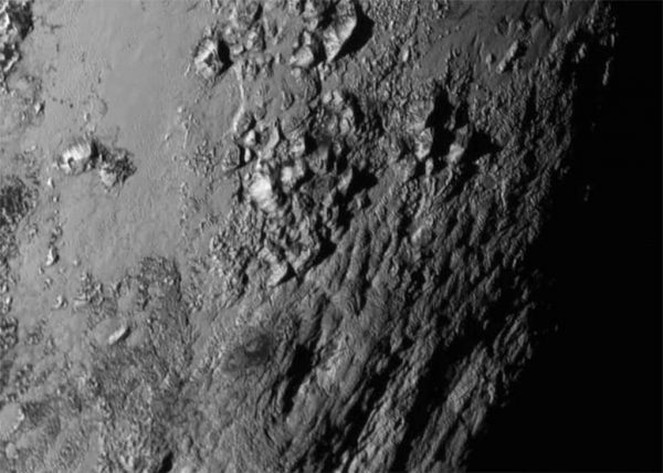 Water ice mountains that reach kilometres into the sky. Image Credit: NASA/JHUAPL/SwRI